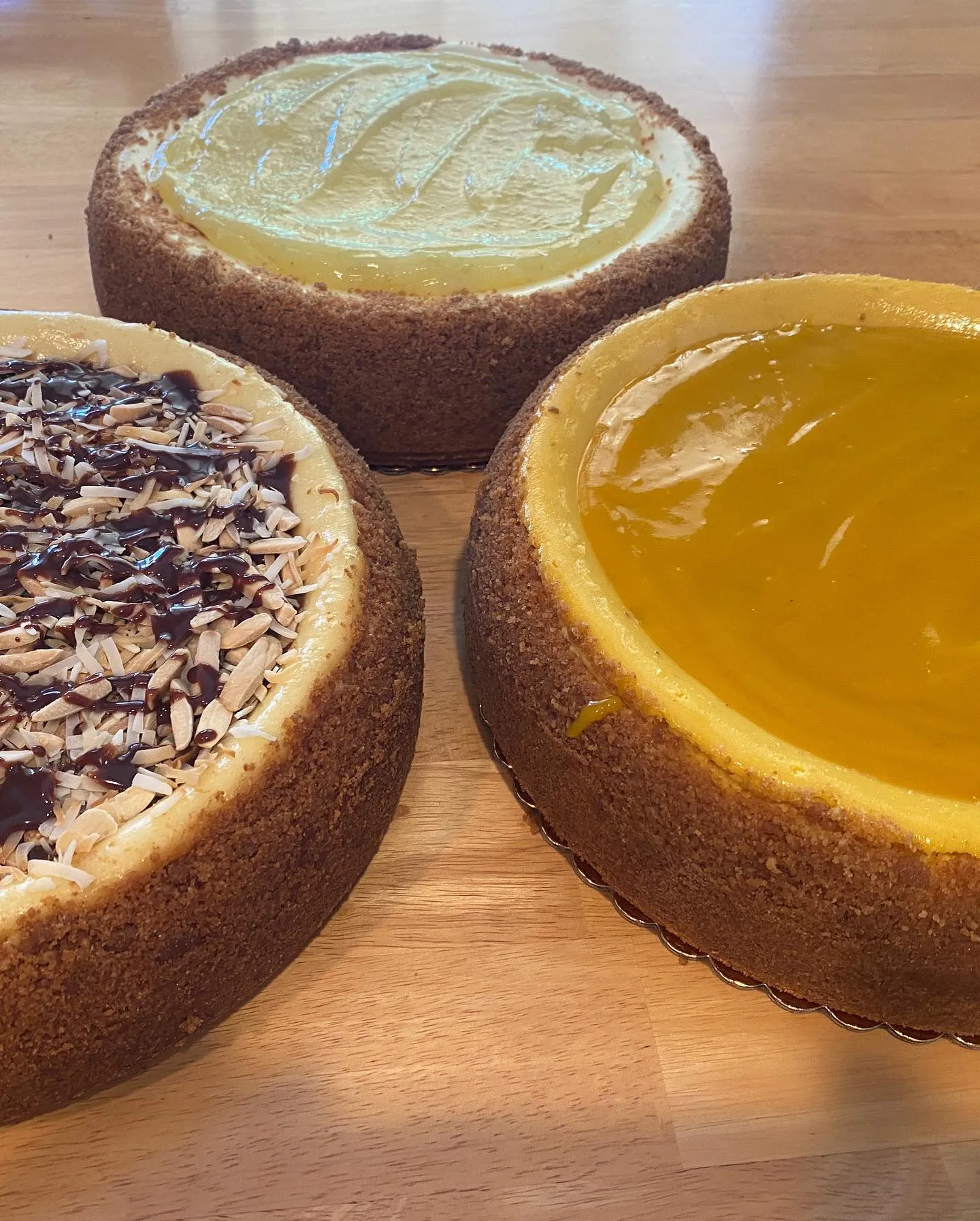 Three cheesecakes — Almond Joy, mango, and key lime.