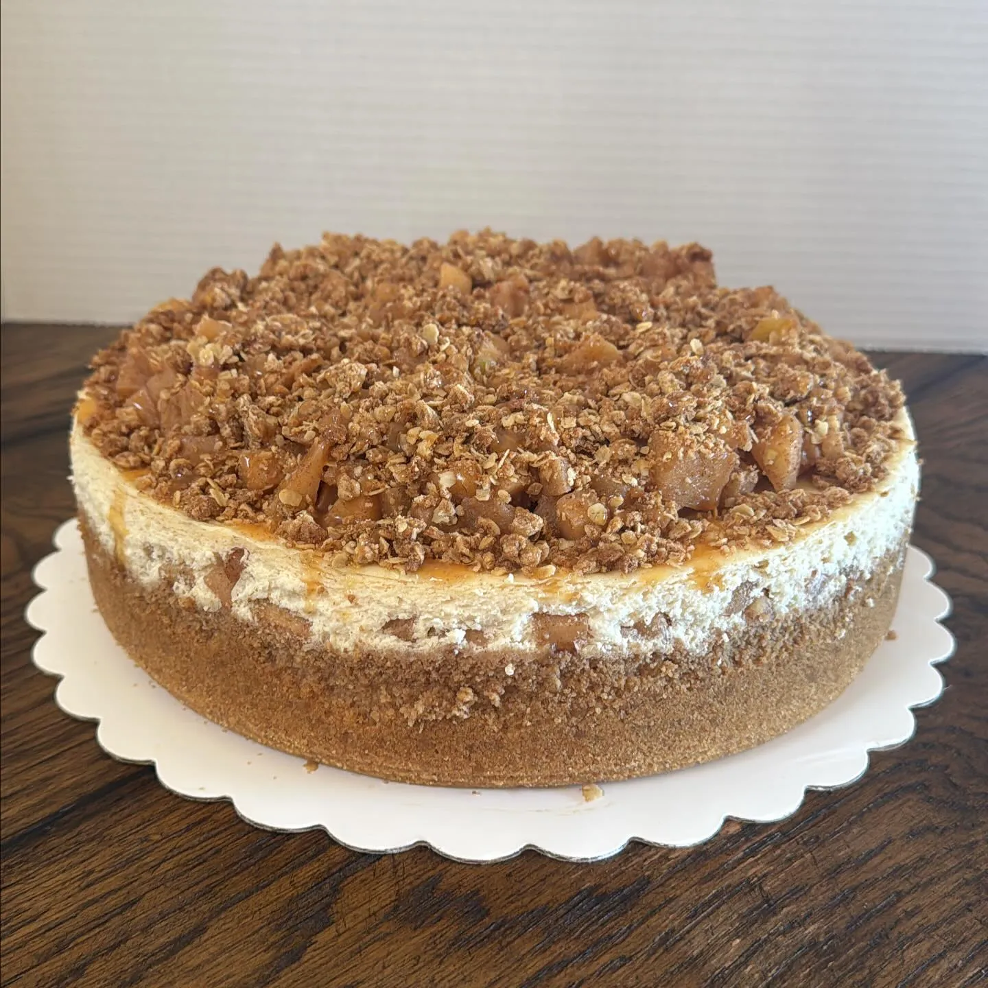 An apple crumble cheesecake topped with cinnamon-oat streusel.