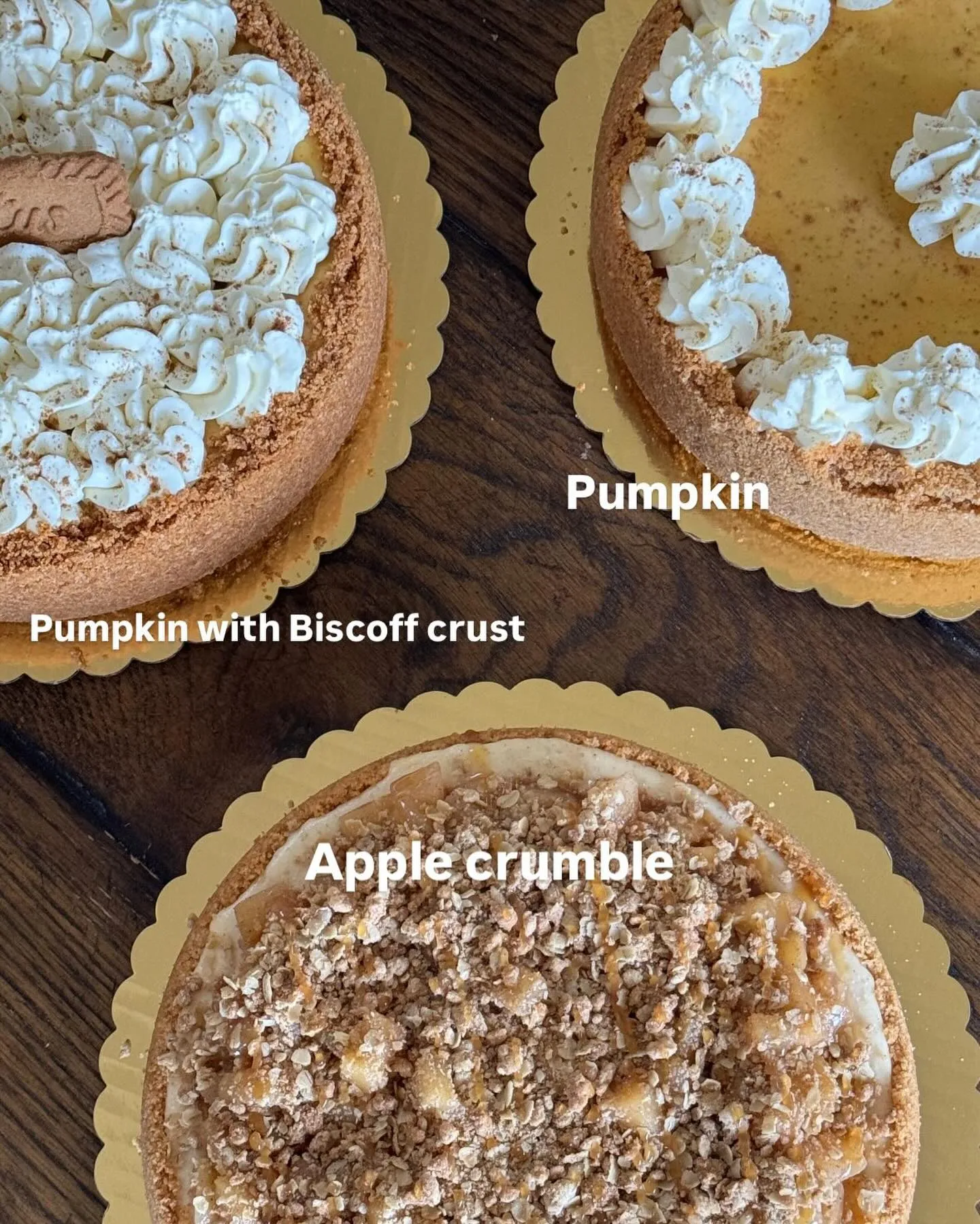 Pumpkin and apple-crumble cheesecakes on gold boards.
